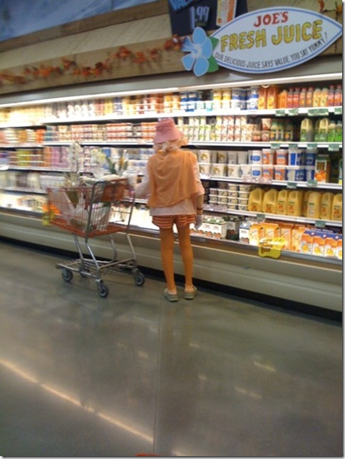 orange lady buying orange juice in trader joes