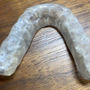 hard plastic night guard with holes in it from incisors